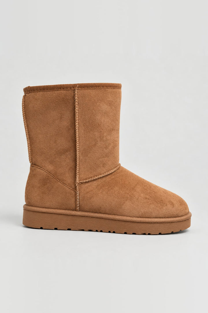 Bottes fourrées coutures apparentes camel, vue de face