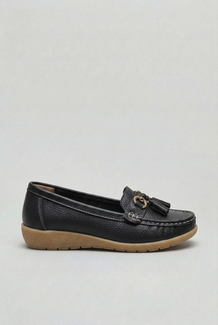 Mocassins à mors et pampilles noir, vue de profil